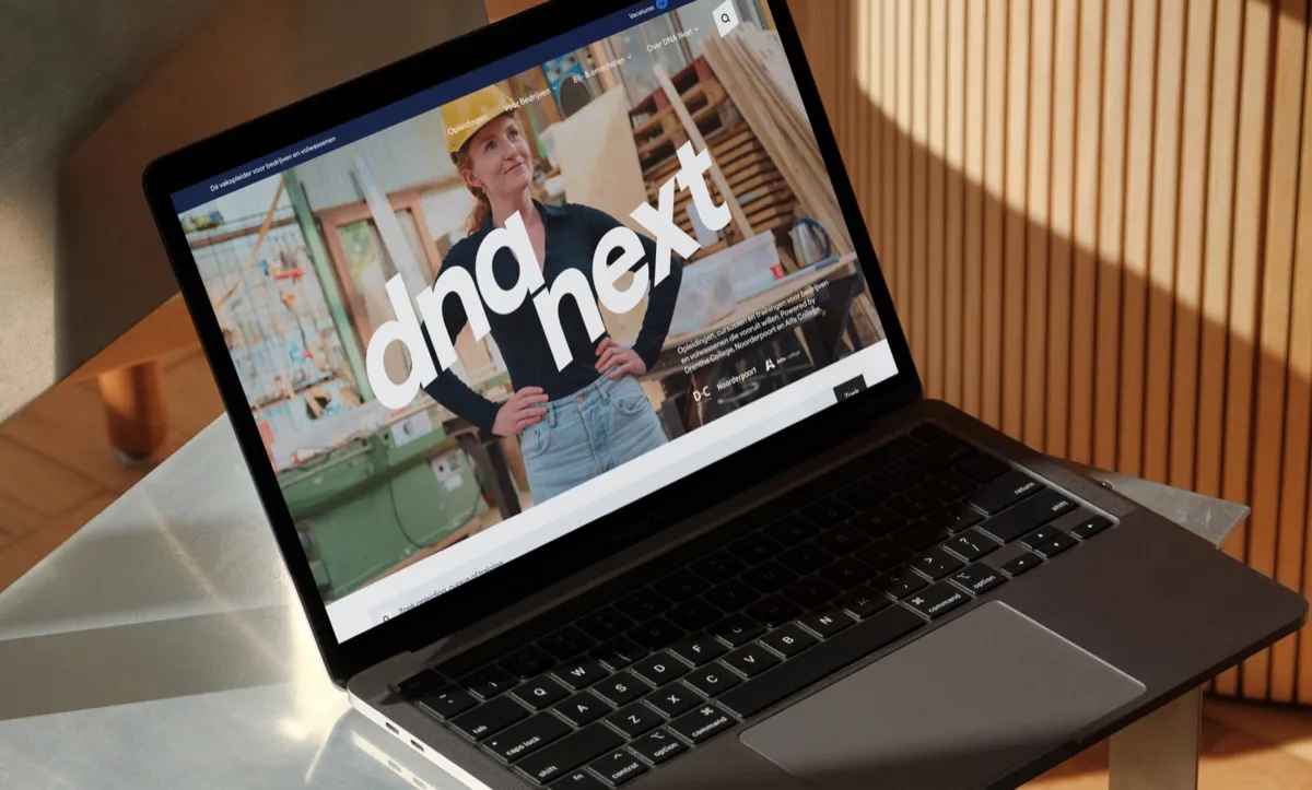 DNA Next website on a laptop